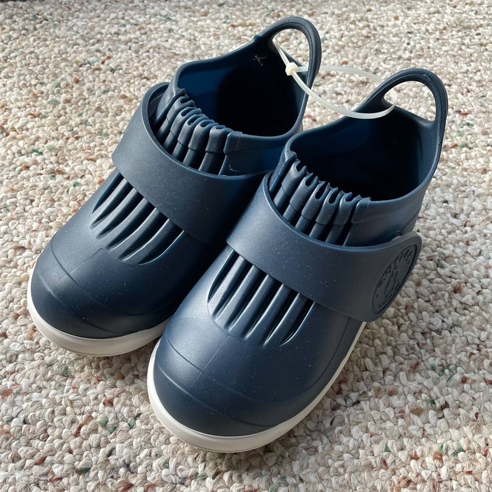 Brand new w/ tags slip on rain shoes in size 12 for kids.